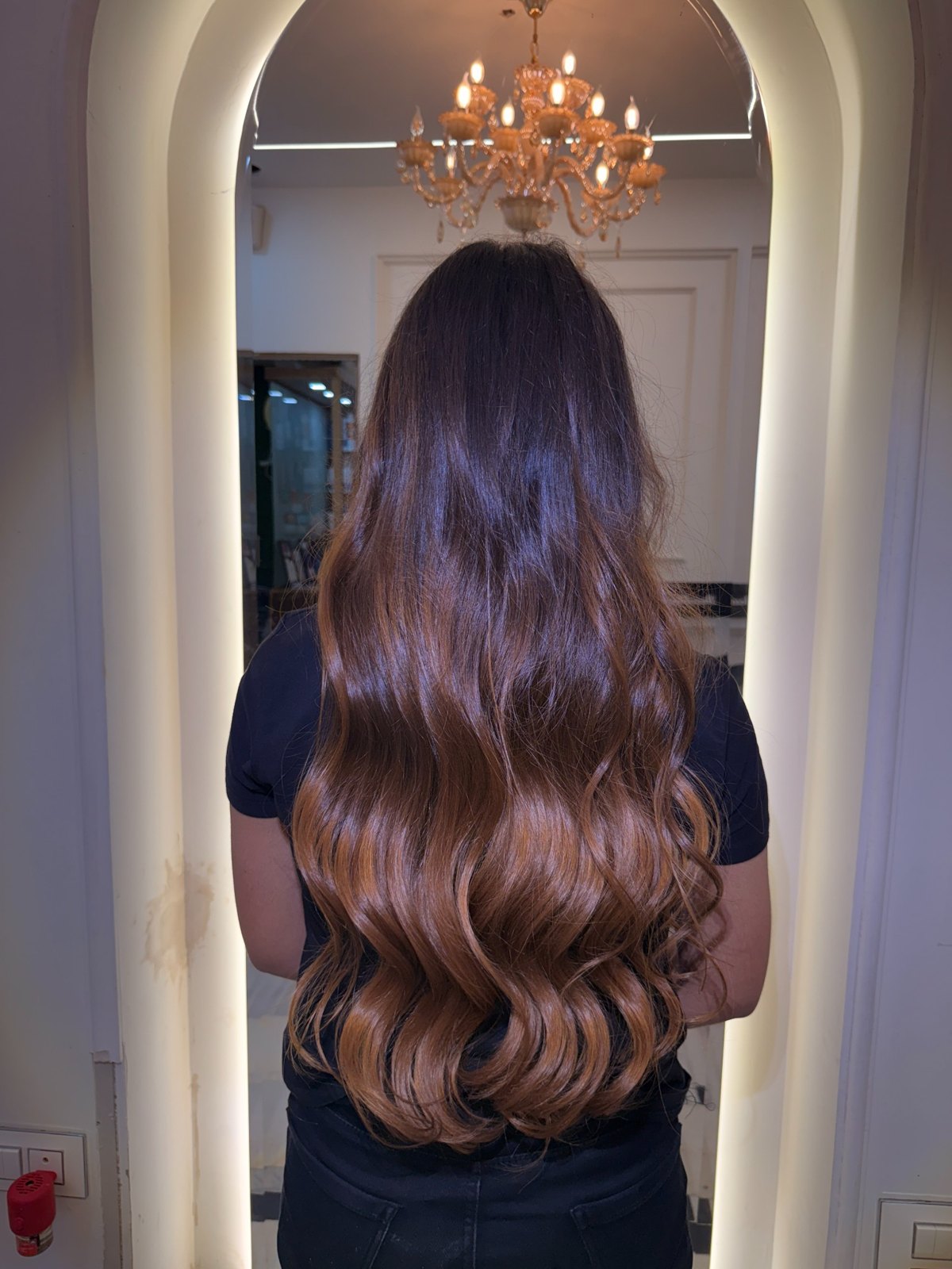 Brown hair colour with soft waves by Aura, colour detail